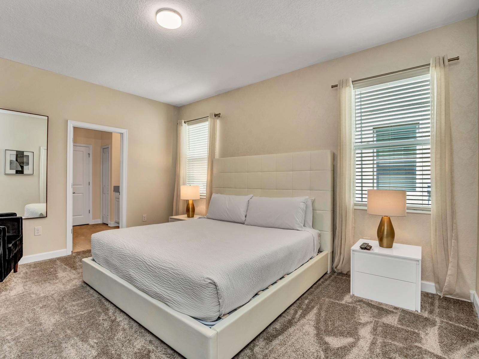 Sophisticated Bedroom of the Apartment in Kissimmee Florida located near Laureate Park Village Center - Comfy King Size Bed - Thoughtfully designed bedroom featuring functional and stylish furniture - Smart TV and Netflix