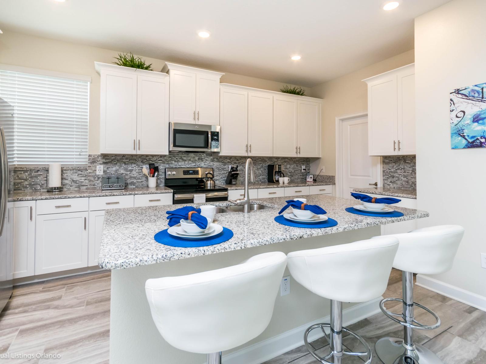 An open concept kitchen that brings out the best in this place. Cook and serve your meals in this area fronting a countertop table and high chairs