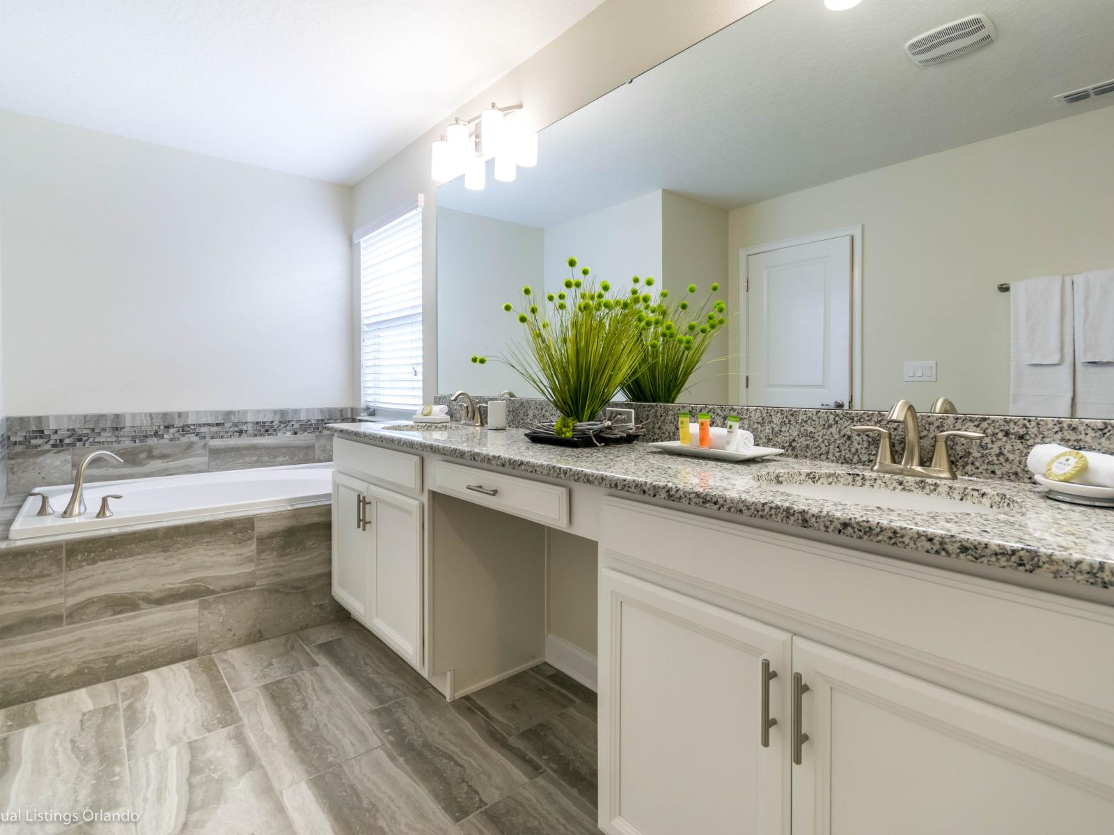 Pamper yourself in our upmarket bathroom with a stylish dual vanity and modern glass-enclosed shower.