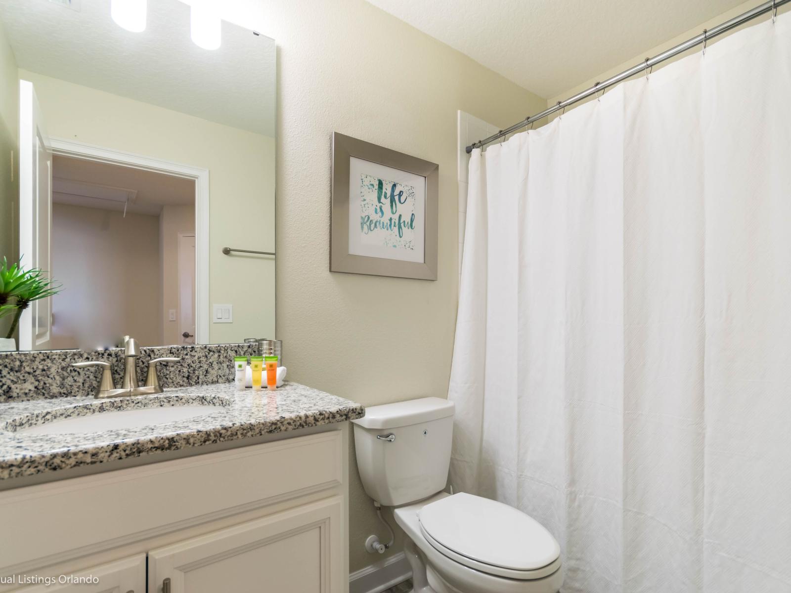 Experience pure relaxation in our spotless and inviting bathroom.