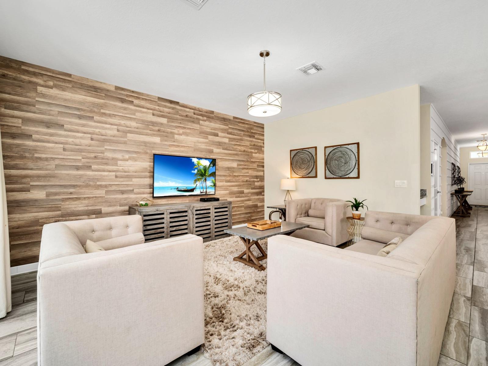 Entertainment Hub: Unwind in our cozy living area, complete with a TV for endless movie nights and relaxation. Whether it's catching up on your favorite shows or enjoying family time, this space is designed for comfort and enjoyment.