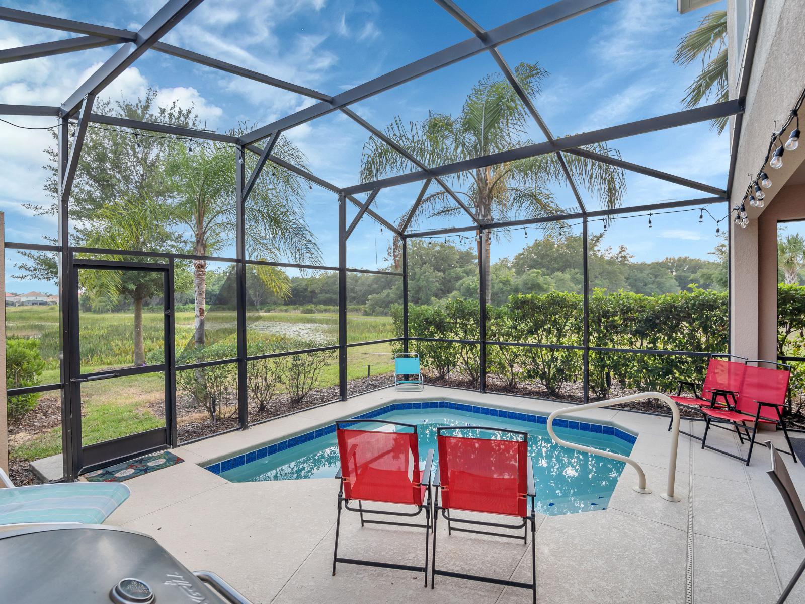 Captivating private pool of the townhouse in Davenport Florida - Bask in sun-kissed luxury near the water - Experience ultimate relaxation in poolside paradise - Comfortable lounge chairs for ultimate relaxation