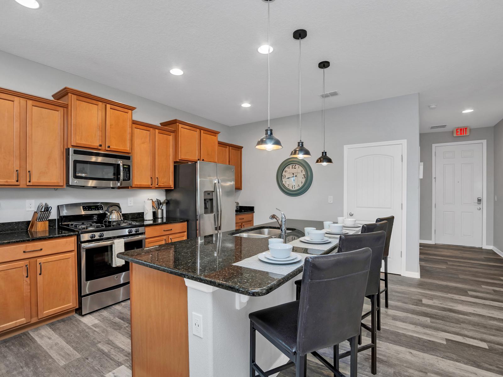 Open-concept kitchen, complete with tasteful furnishings and stylish accents that transform cooking into a truly delightful experience