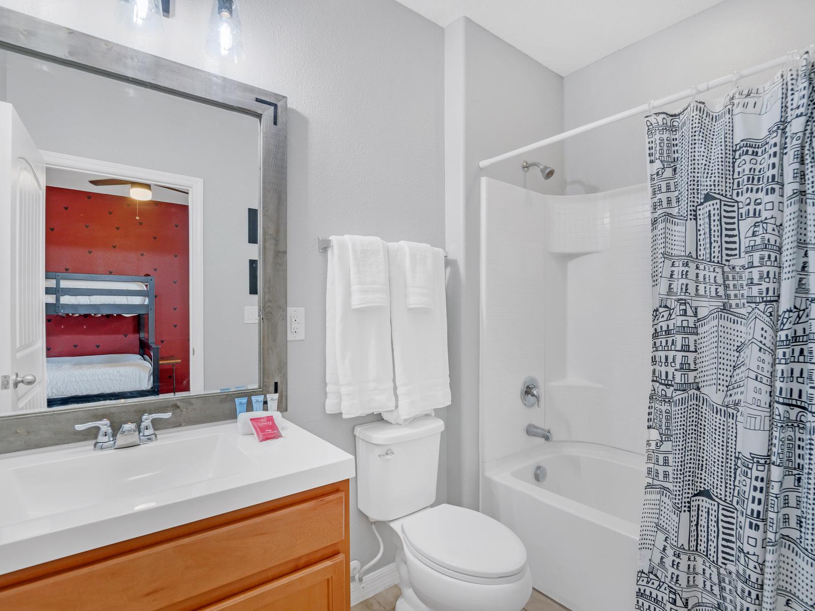 Indulge in a spa-like experience in our sleek and modern bathroom, complete with luxurious amenities.