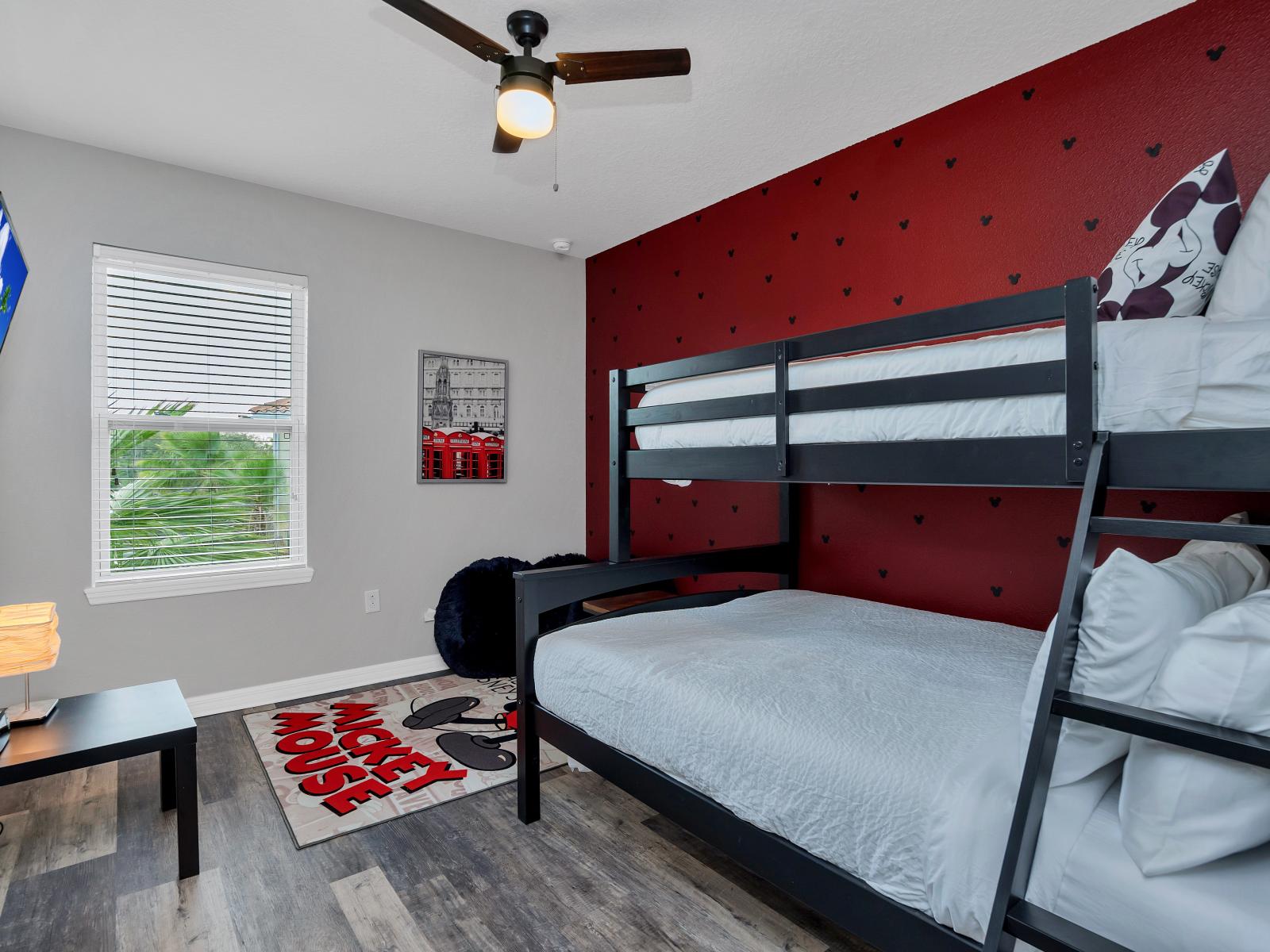 Mickey Mouse decored bedroom of the townhouse in Davenport Florida - Stylish bunk bed - Smart TV to enjoy your favorite shows - Modern and stylish decor that complements the space