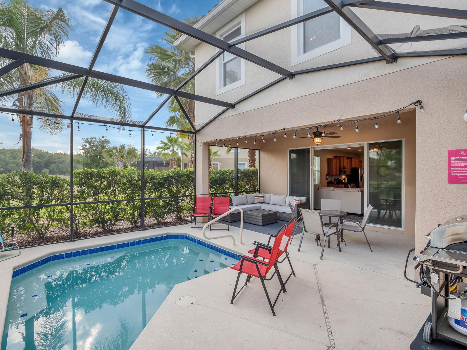 Embrace outdoor living at its finest in picturesque oasis, featuring comfortable seating and a sparkling pool for endless relaxation.