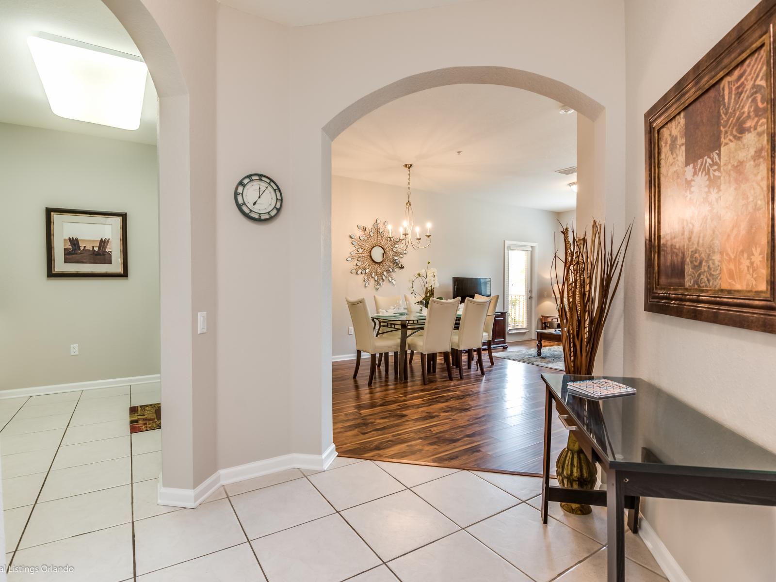 Traverse through the hallway leading to the heart of the condo, where the kitchen, dining, and living areas seamlessly blend together, promising a delightful experience for all.