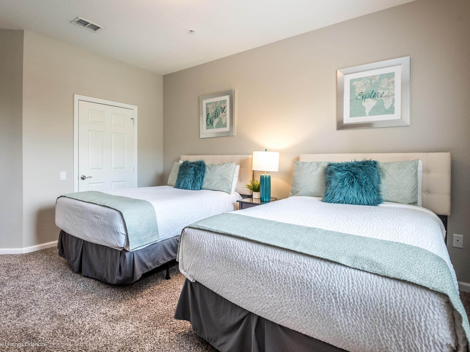 Cozy Bedroom Retreat: Unwind in this comfortable space featuring twin beds, providing a cozy and inviting atmosphere for relaxation.