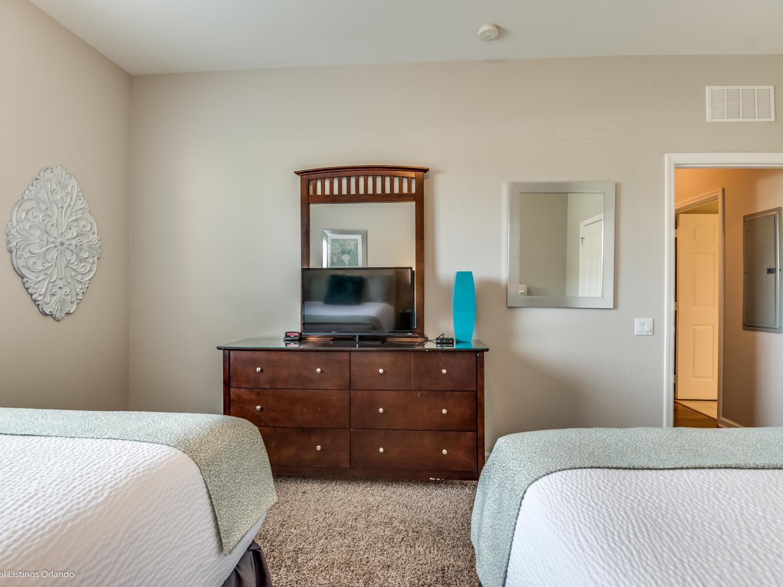 Dual Comfort: Relax and unwind in our inviting bedroom with two beds. Perfect for families or friends traveling together, this cozy space offers double the comfort for a restful night's sleep.