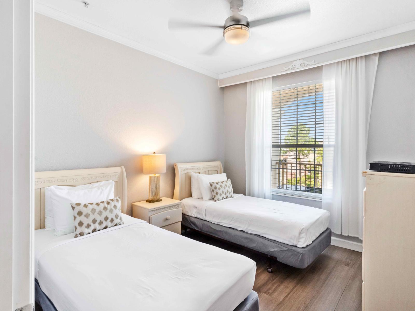 Relax and unwind in our inviting bedroom with two beds. Perfect for families or friends traveling together, this cozy space offers double the comfort for a restful night's sleep.