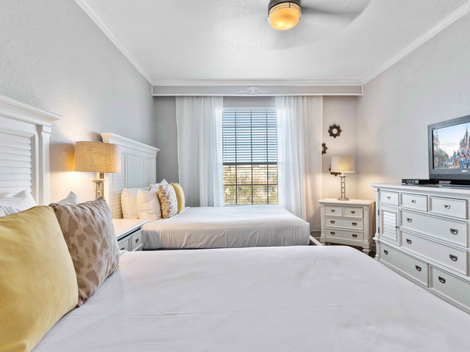 This inviting bedroom features two beds, providing ample space for a restful night's sleep.