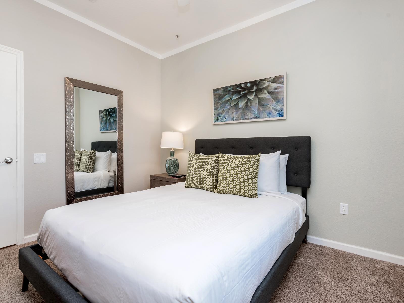 This spacious second bedroom offers ample space for two to unwind and rest, providing a cozy retreat for ultimate relaxation.