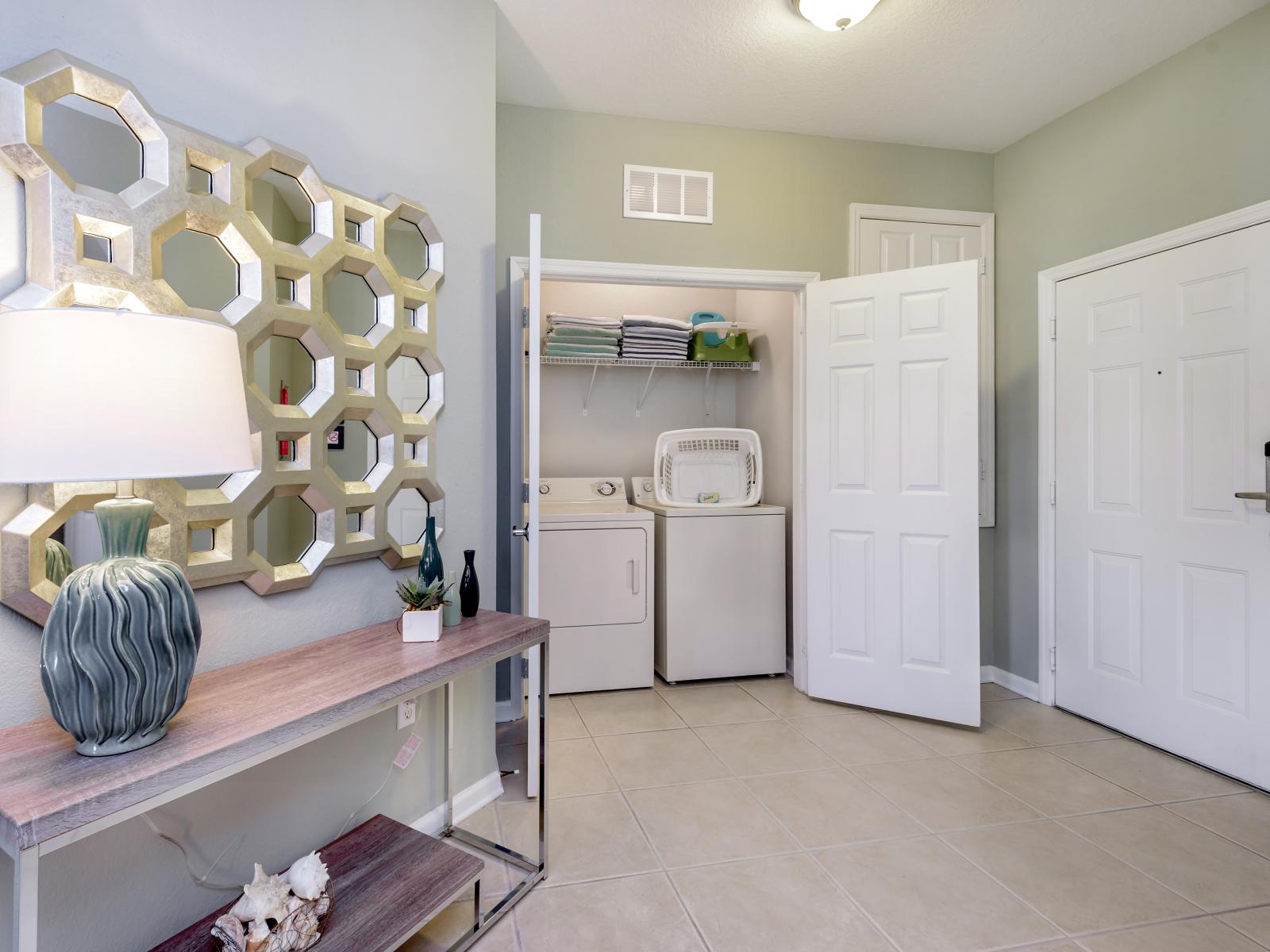 Conveniently located within the apartment, the laundry area boasts a full-size washer and dryer, ensuring that you can easily keep your clothes fresh and clean throughout your stay.