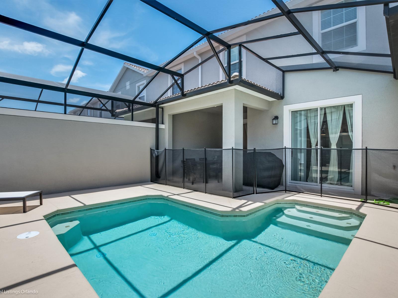 Refreshing private pool area of the town house in Kissimmee Florida - Bask in sun-kissed luxury near the water - Dive into a refreshing poolside escape - Enjoy leisurely moments in inviting pool area - Lounge in tranquility by the sparkling waters