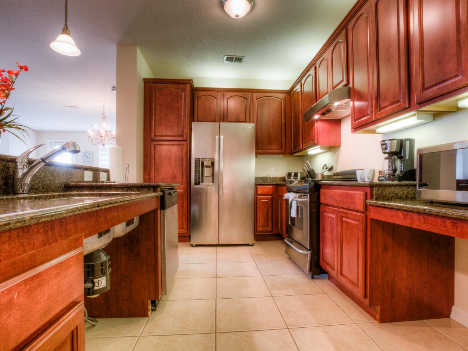 Prepare your favorite meals in the fully equipped kitchen, complete with modern appliances, and enjoy them at the countertop table with comfortable high chairs.