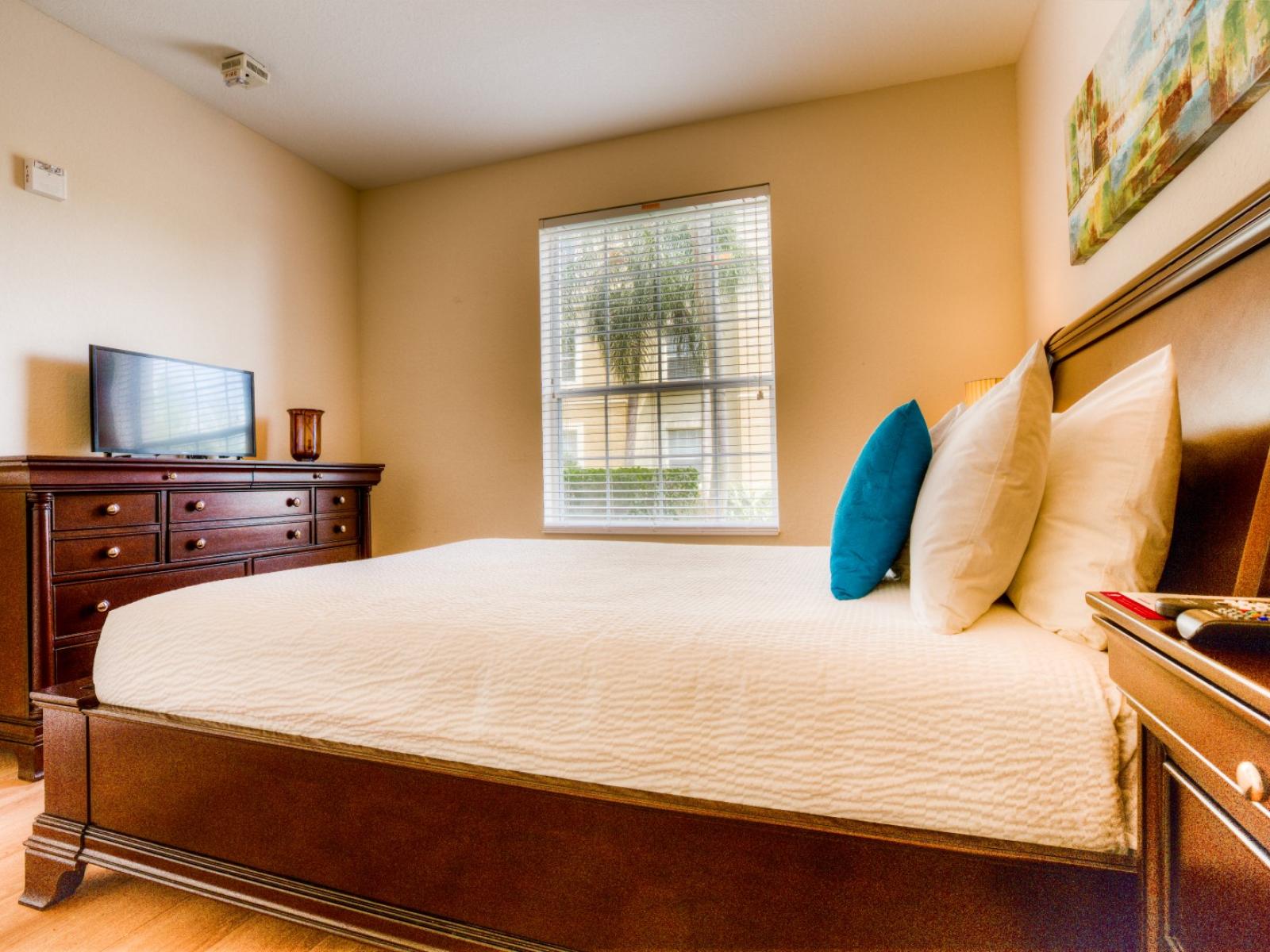 The second bedroom features a comfortable queen-size bed, offering a cozy retreat for guests. With its inviting ambiance and plush bedding,