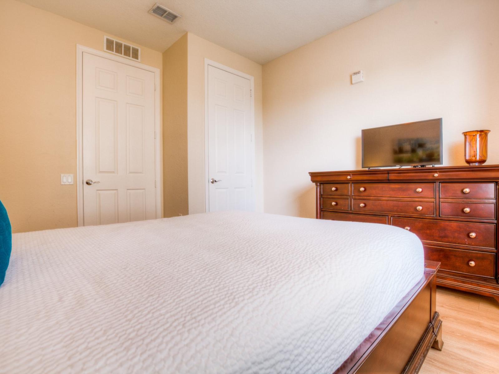 Cozy up in the second bedroom with a convenient TV for added entertainment and relaxation.