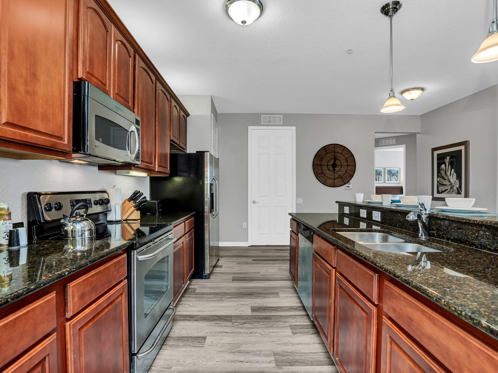 Casual Dining Delight: Relish in casual dining delight in our kitchen, where the countertop table provides a laid-back space for meals