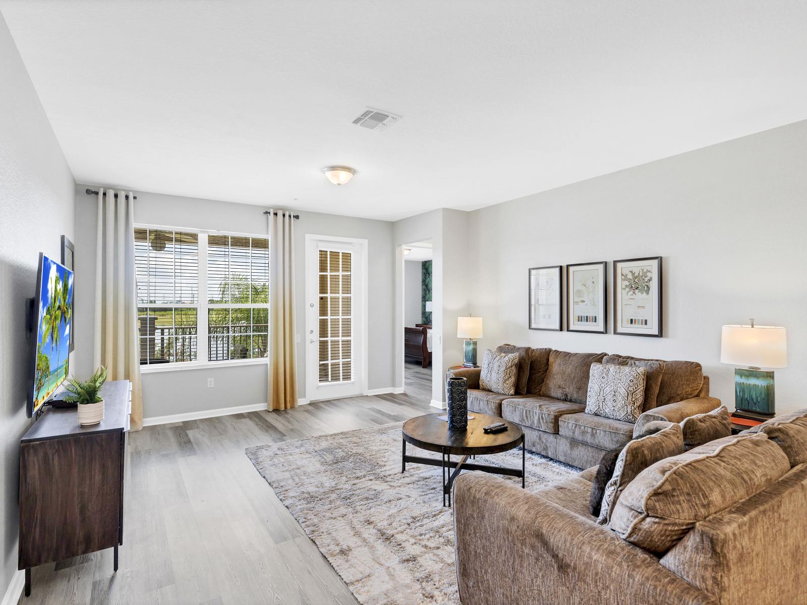 Relaxation Oasis: Sink into the sumptuous sofa, surrounded by stylish accents and warm hues, making this living room a true haven for relaxation