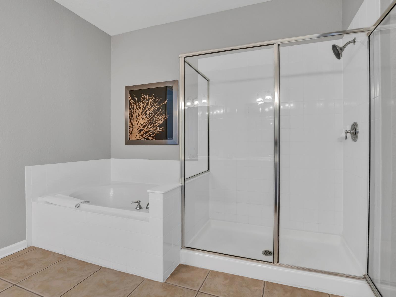 The shower enclosure  and a relaxing bathtub, providing the perfect retreat for unwinding after a long day of adventures.