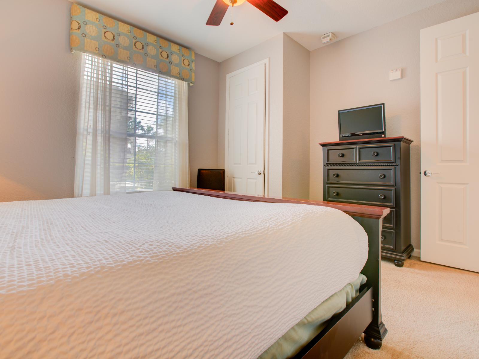 This bedroom showcases the timeless allure of wood merges with comfort, creating a cozy haven for rest and rejuvenation.