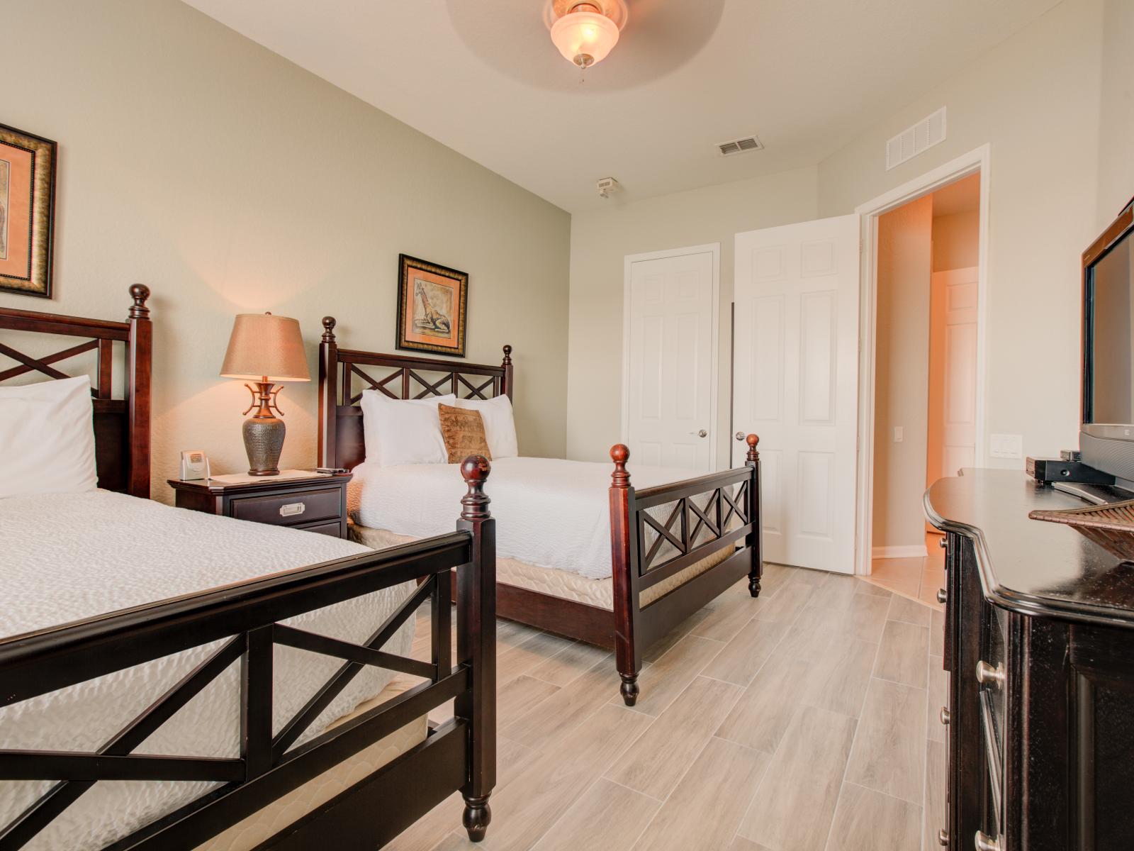 Experience the charm of rustic elegance in this  bedroom with two wooden beds – where every night becomes a journey into comfort and every detail whispers the timeless allure of natural beauty.