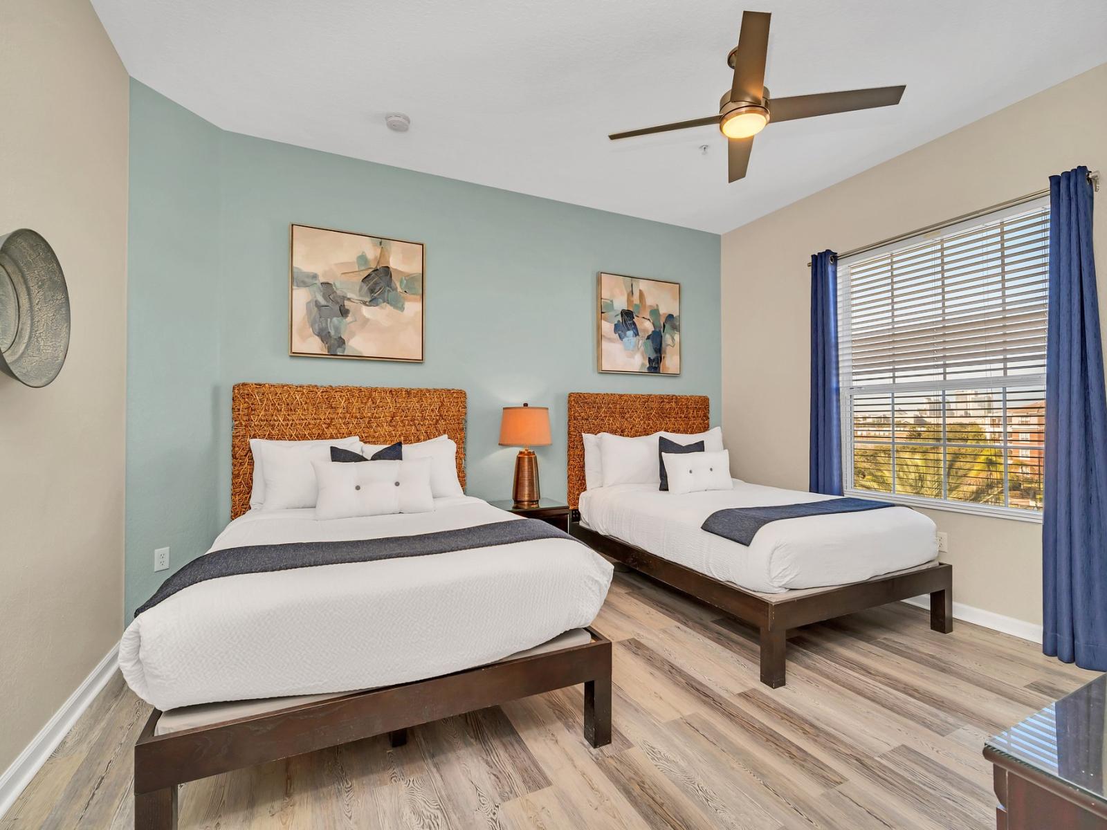 Relax and unwind in our inviting bedroom with two beds. Perfect for families or friends traveling together, this cozy space offers double the comfort for a restful night's sleep.