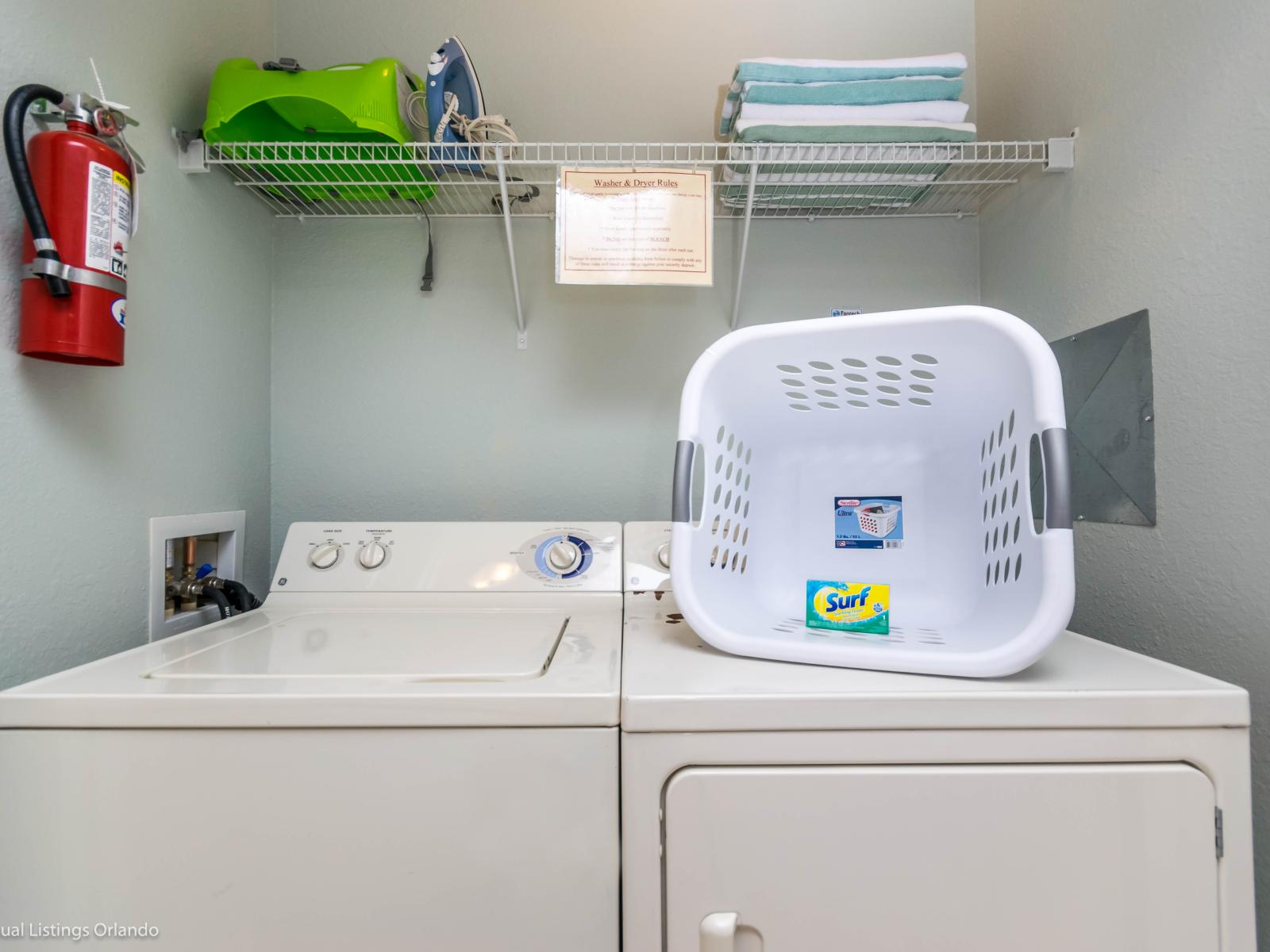 The laundry area boasts a full-size washer and dryer, ensuring that you can easily keep your clothes fresh and clean throughout your stay.