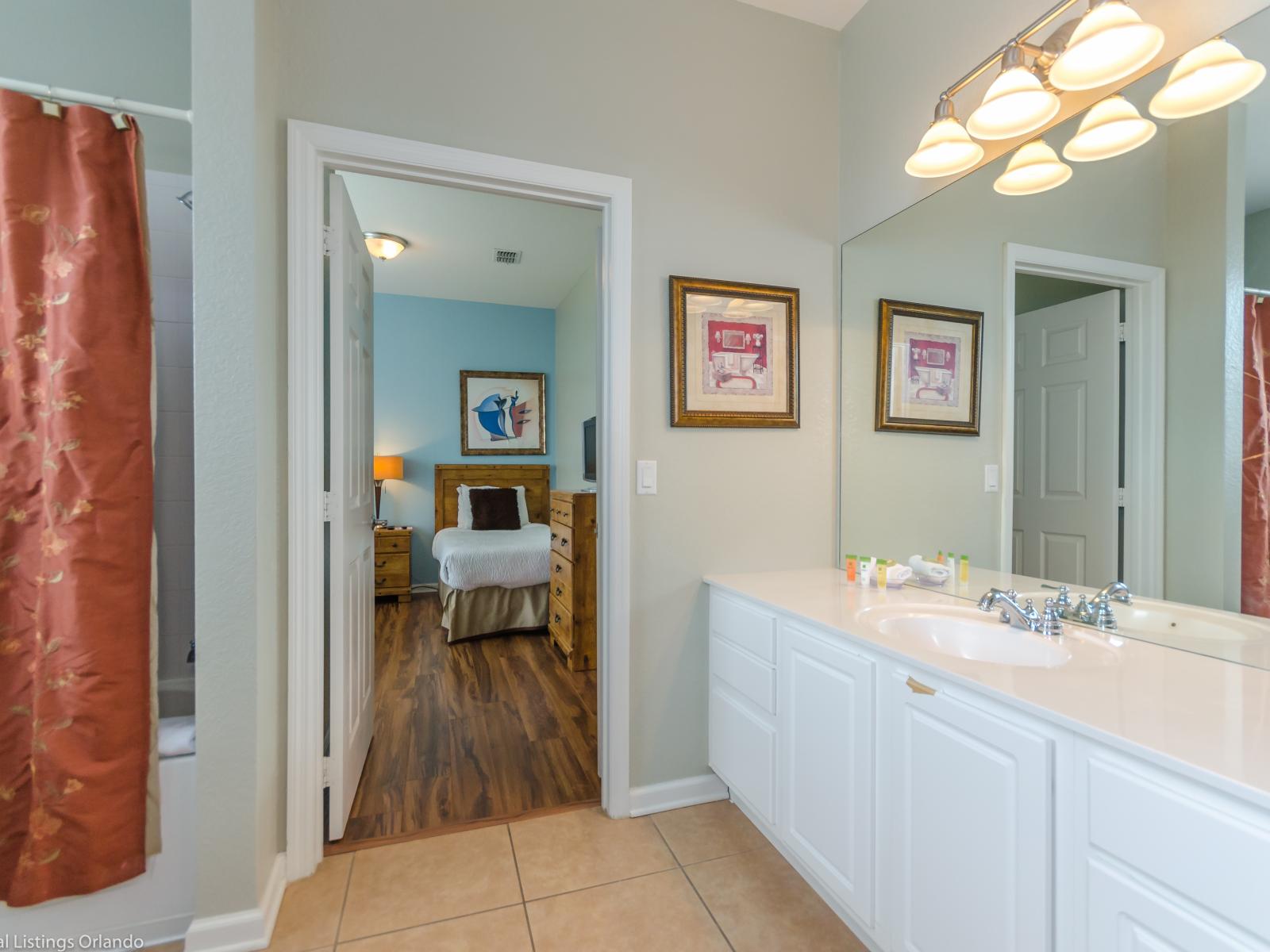 The vanity area is a testament to sophistication, where every detail, from the mirror to the fixtures, is carefully curated to enhance your grooming ritual.