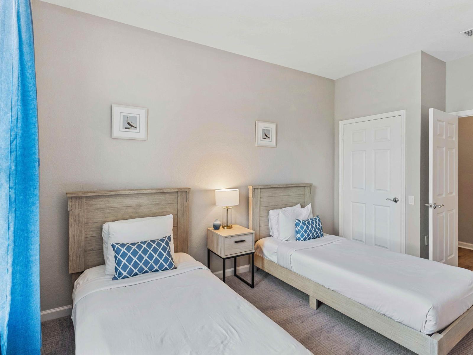 Discover comfort and versatility in Bedroom 2, featuring two cozy twin beds, perfect for accommodating guests or family members with individual sleeping preferences. Enjoy a peaceful night's rest in this inviting space, designed for ultimate comfort