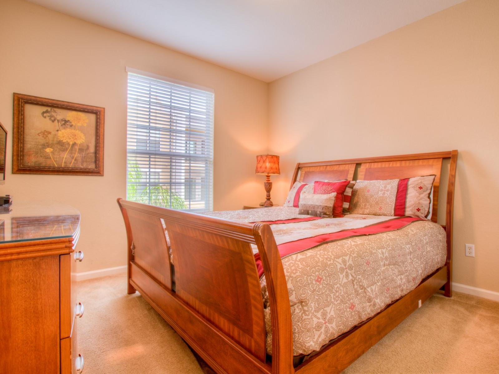 Deluxe Bedroom of the Apartment in Orlando Florida - Full King Size Bed - Minimalist decor, creating a clean and uncluttered sleeping space - Cozy retreat with a plush bed, perfect for relaxation - Soft, lighting for a tranquil mood