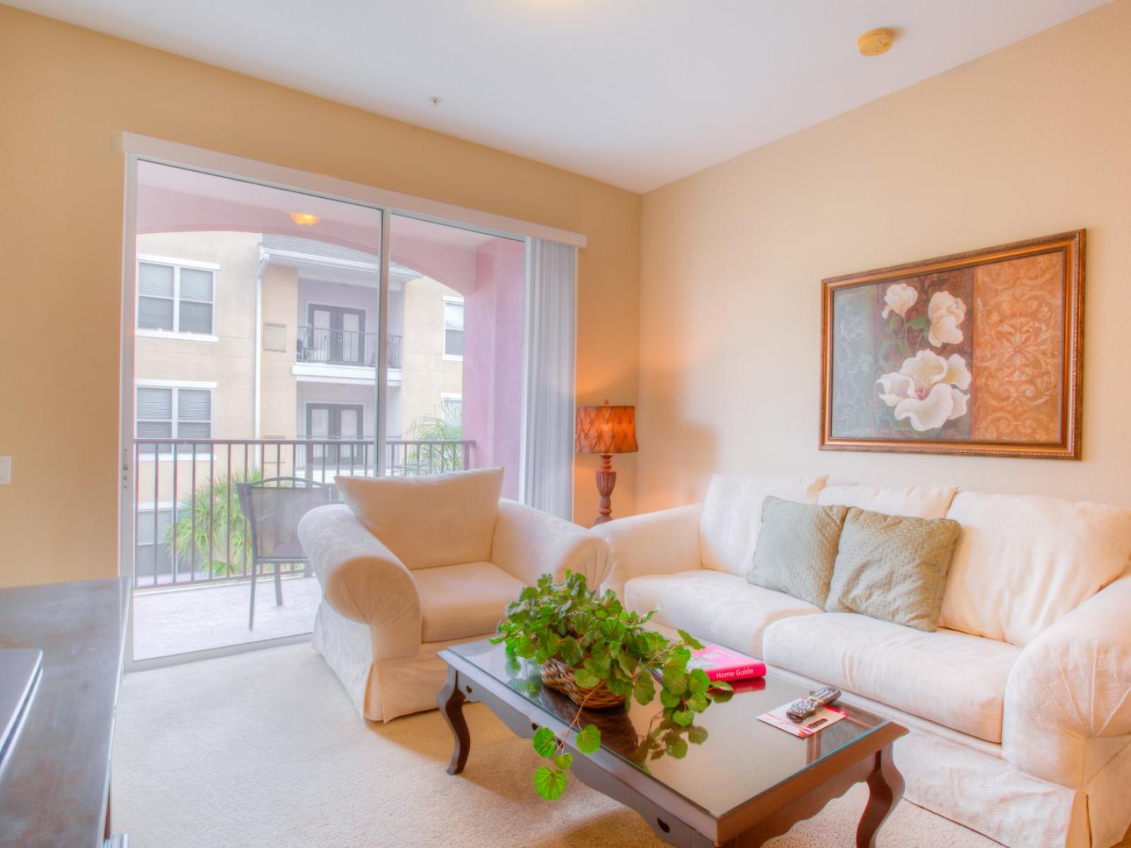 Lush Living Area of the Apartment in Orlando Florida - Cozy and Comfy Sofa - Plants for a refreshing and lively ambiance - Private Balcony - Availability of TV and Netflix