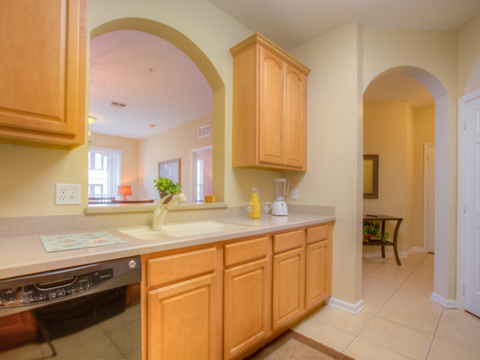 Elegant Kitchen of the Apartment in Orlando Florida - Flavors mingle, memories are made, and every dish tells a tale of delicious moments shared - Modern kitchen with sleek, stainless steel appliances - Smart use of space with versatile storage