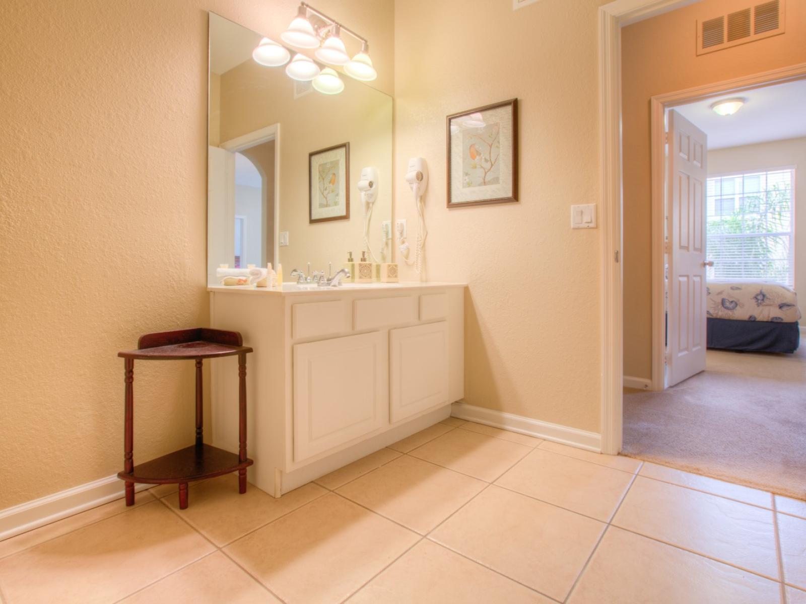 Lush Bathroom of the Apartment in Orlando Florida - The chic vanity area is where glamour meets sophistication - Inviting bathroom with a soothing color palette for a tranquil feel