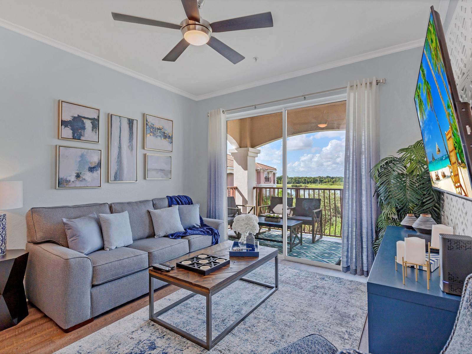 Sunny living room with big 75" smart TV.