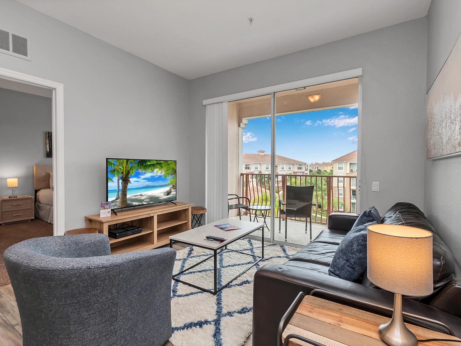 - Enchanting living area of the condo in Orlando Florida - Smart TV and Netflix - Chic and contemporary living area design with modern furnishings - Cozy seating area with sofas - Big and bright sliding doors that leads to the private balcony