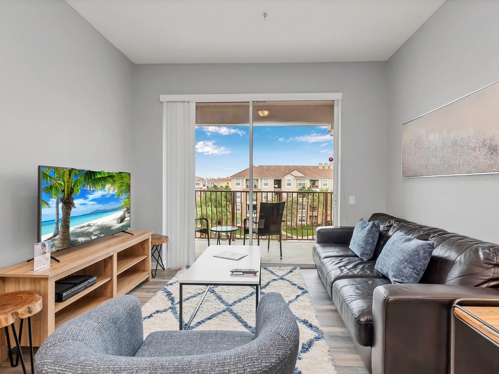 - Exquisite Living Area of the condo in Orlando Florida - Plenty of seating capacity, perfect for groups, family and friends - Smart TV and Netflix - Comfy sofas to sit and relax - Gloriously designed sliding doors leading to the private balcony