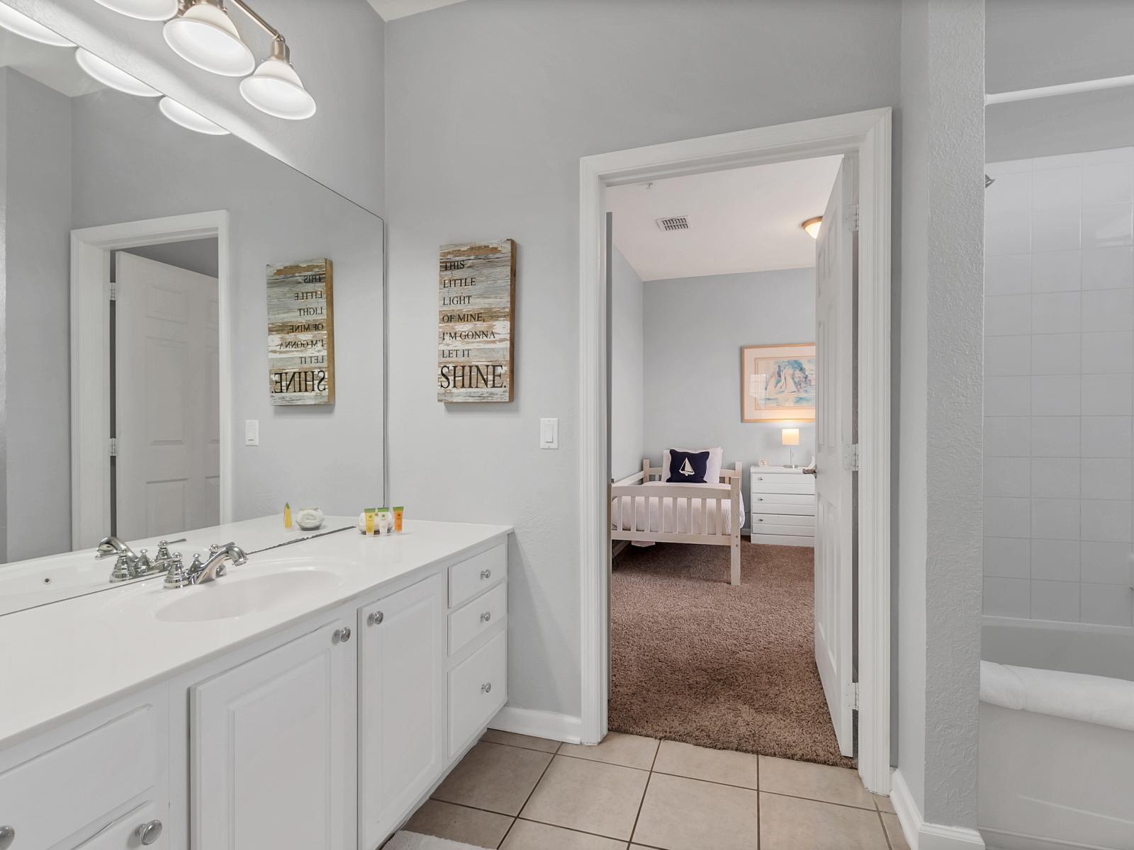 Walk into Relaxation: Our Airbnb bathroom invites you to indulge in a modern retreat, complete with a spacious walk-in shower for a luxurious bathing experience