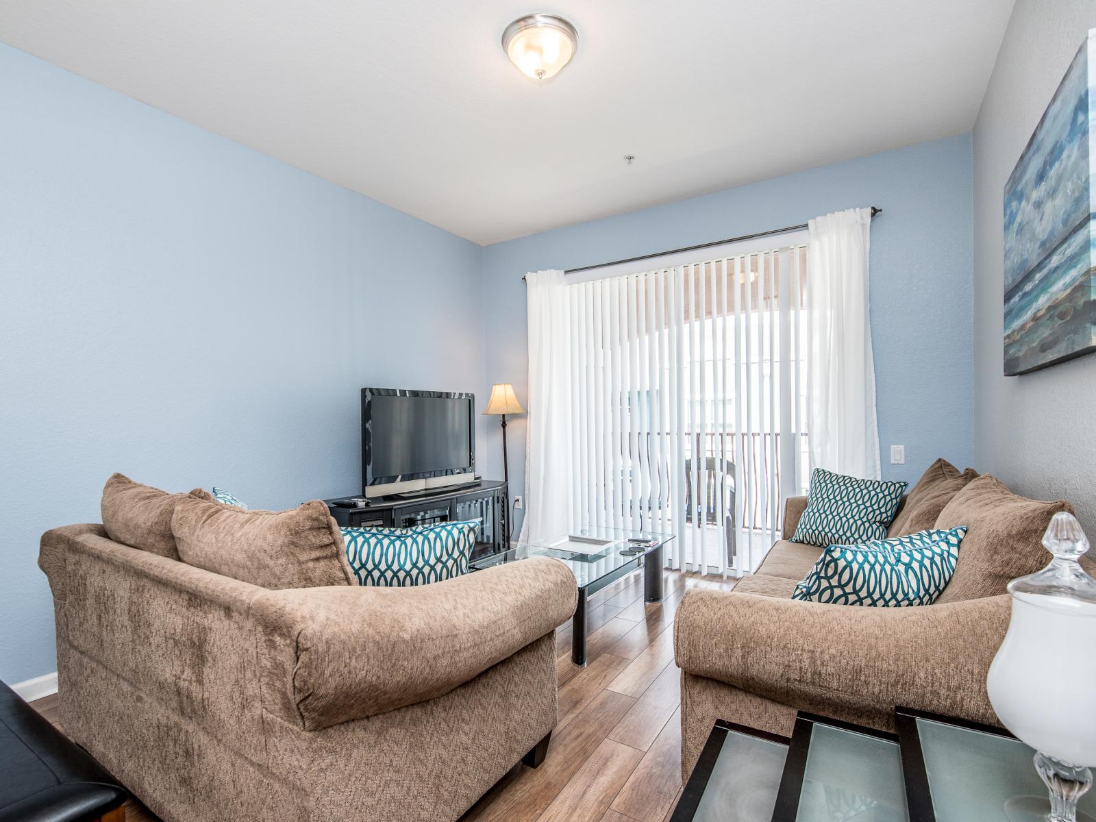 Enjoy easy transitions between the living area, dining table, and kitchen, all while having convenient access to the private balcony for a breath of fresh air.