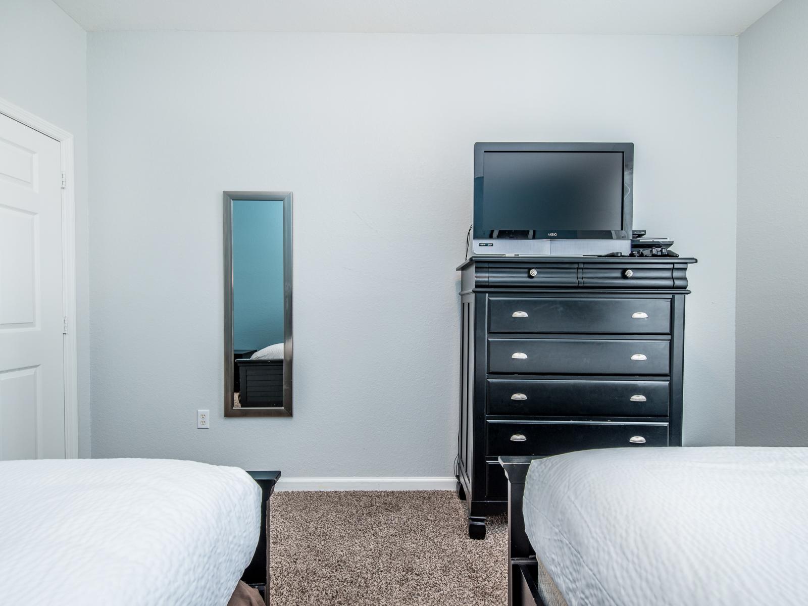 This twin bedroom provides additional sleeping space, perfect for accommodating extra guests and ensuring a restful night for all.