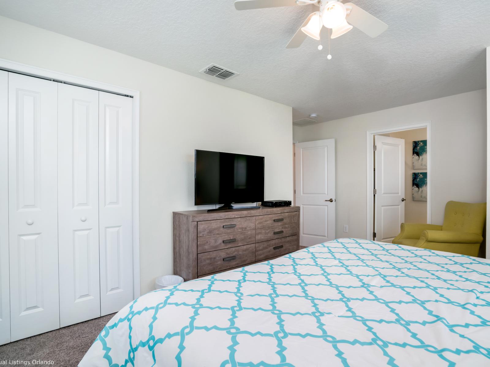 A vibrant look of another bedroom in the townhouse where it is found to be stylish which has its own bathroom