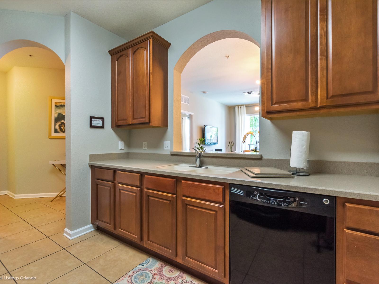 A kitchen adorned with wooden shelves and cabinets, adding warmth and charm to the culinary space.