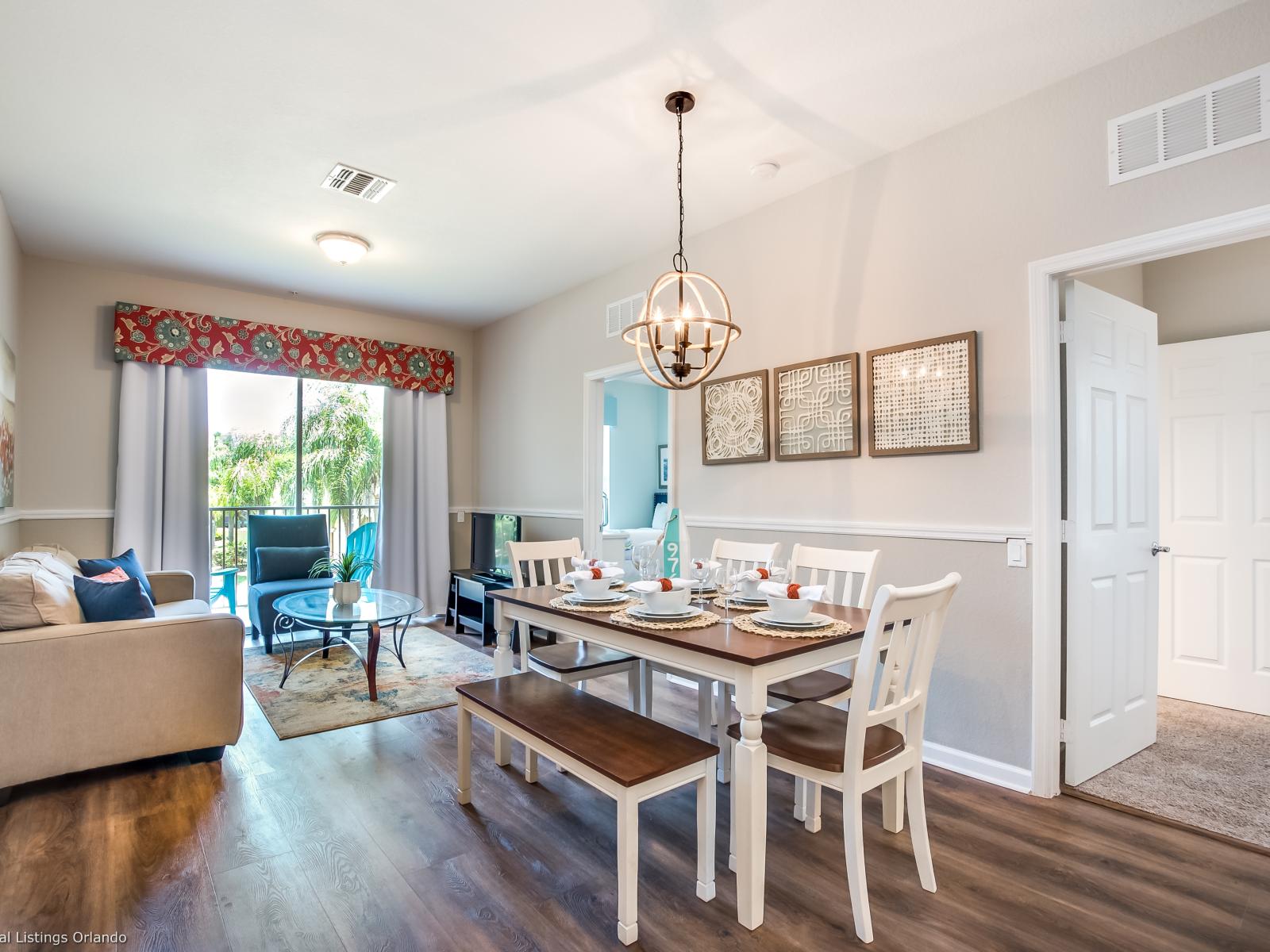 The dining and living area invites you to gather and unwind in comfort and style. A space where meals transform into cherished memories and relaxation becomes an art, promising moments of togetherness and joy.