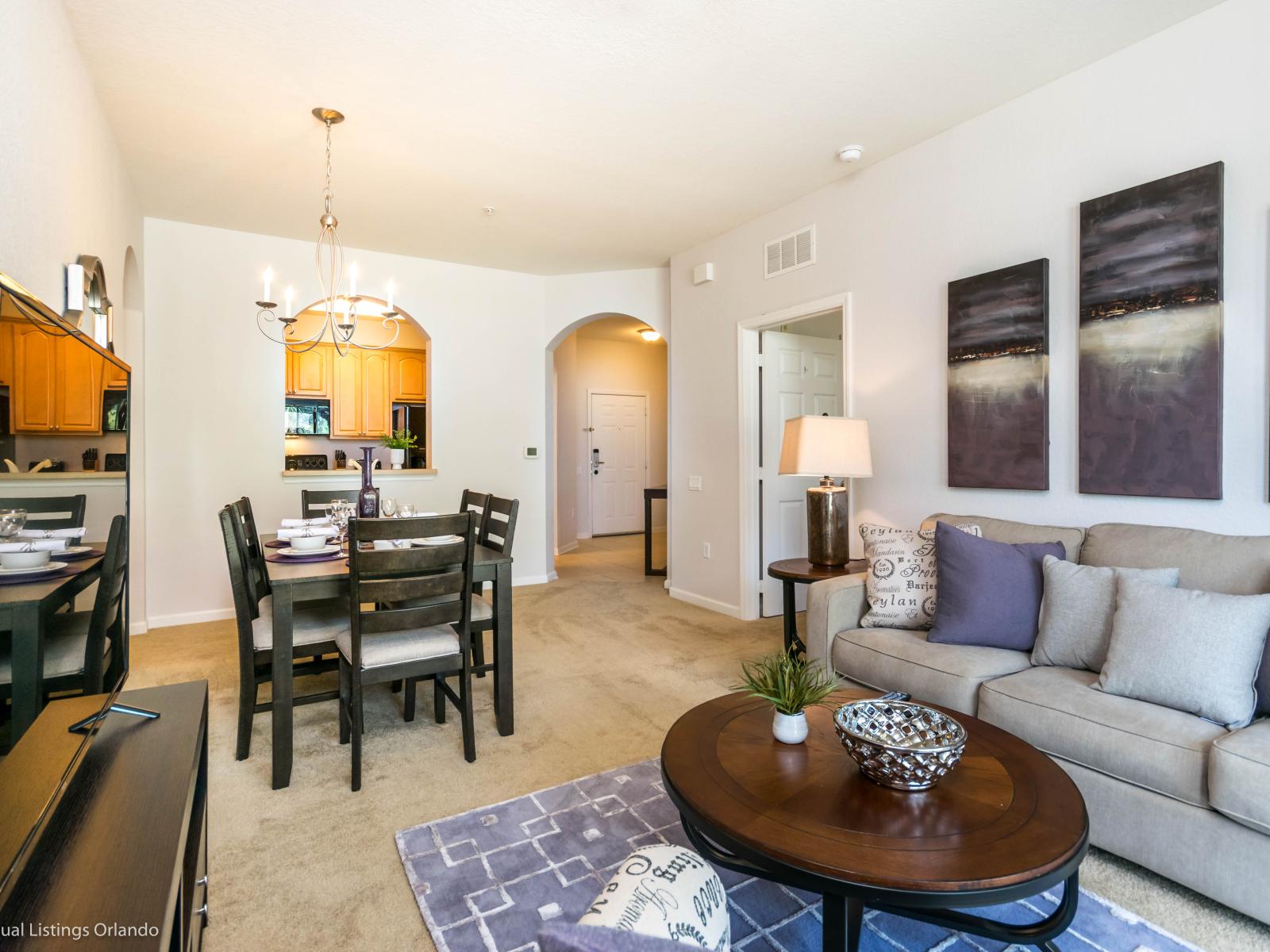 Homey living area of the condo in Orlando Florida - Well-chosen lighting fixtures adding both functionality and charm - Smart TV - Artfully arranged decor elements, from wall art to decorative accessories - Harmonious blend of textures and material