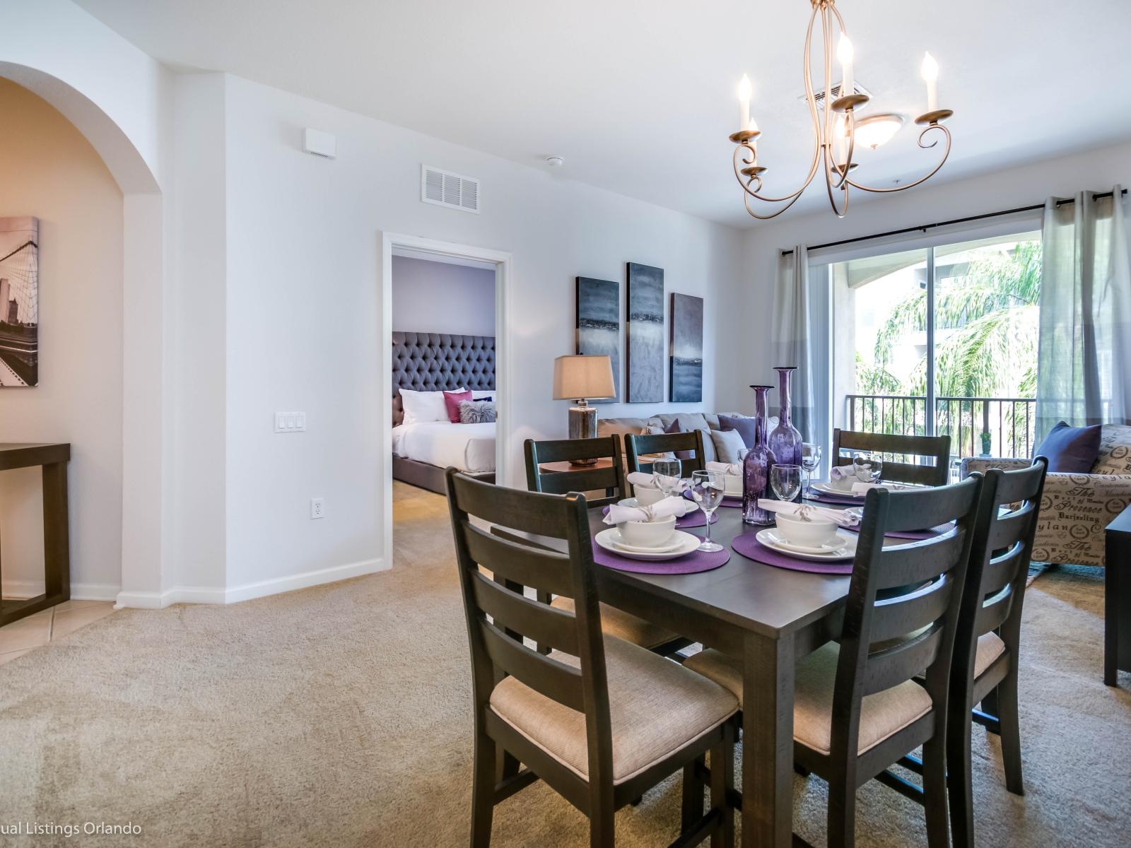 Charming living and dining area of the condo in Orlando Florida - 6 Persons dining - Open-concept living area seamlessly connected to a stylish dining space - Stylish furniture arrangement providing comfort and a cohesive look