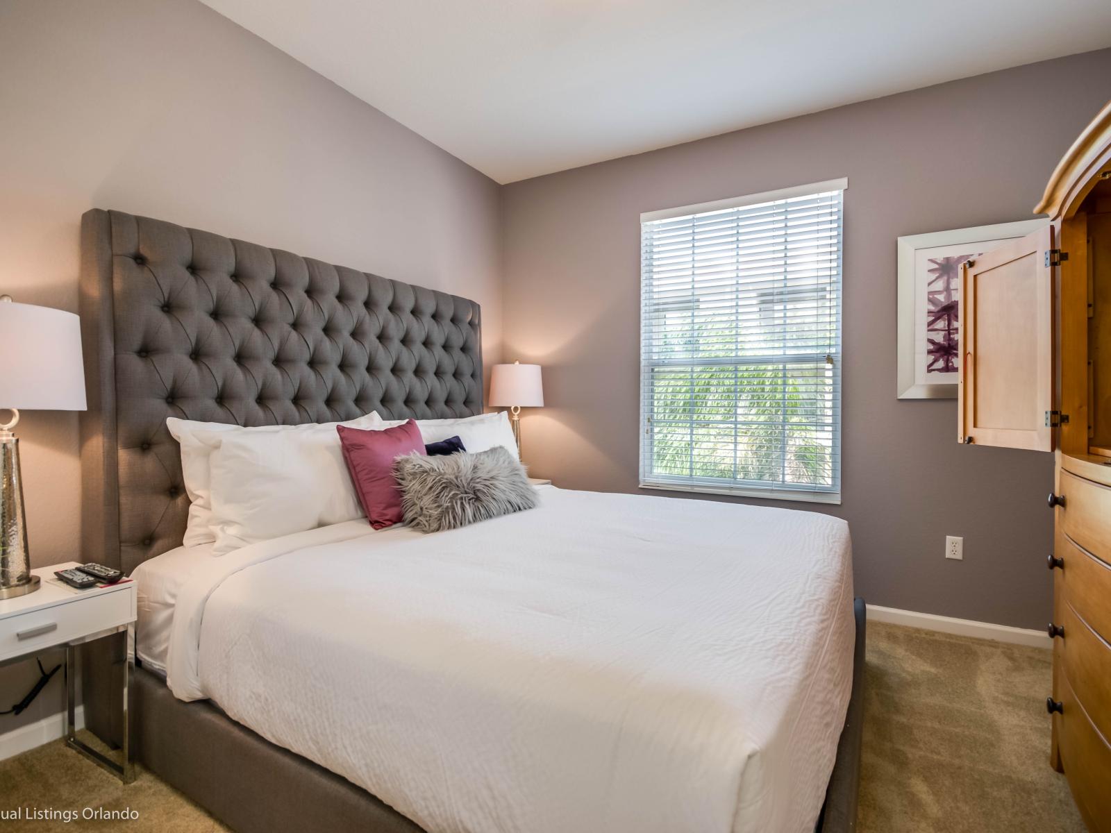 Inviting bedroom of the condo in Orlando Florida - Cozy retreat with a plush bed, perfect for relaxation - Entertainment with smart TV - Tranquil bedroom retreat for restful nights