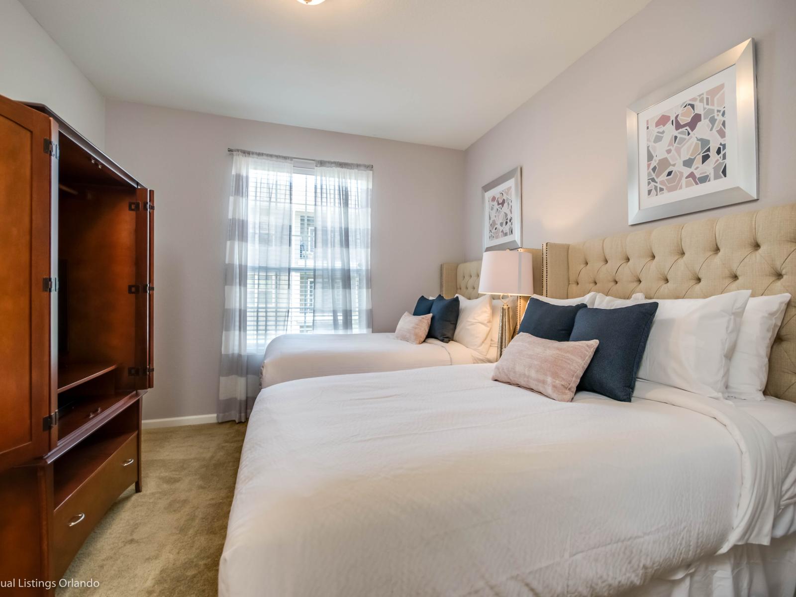 Cozy bedroom of the condo in Orlando Florida - Bedroom with a cozy ambiance, blending comfort and aesthetics - Featuring 2 double bed - Inviting atmosphere designed for a restorative sleep