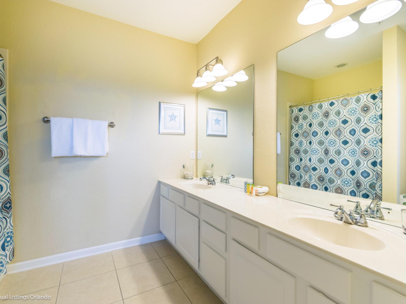 Elevated Shower Experience: Step into our bathroom with a walk-in shower, offering a perfect blend of style and convenience for a refreshing getaway