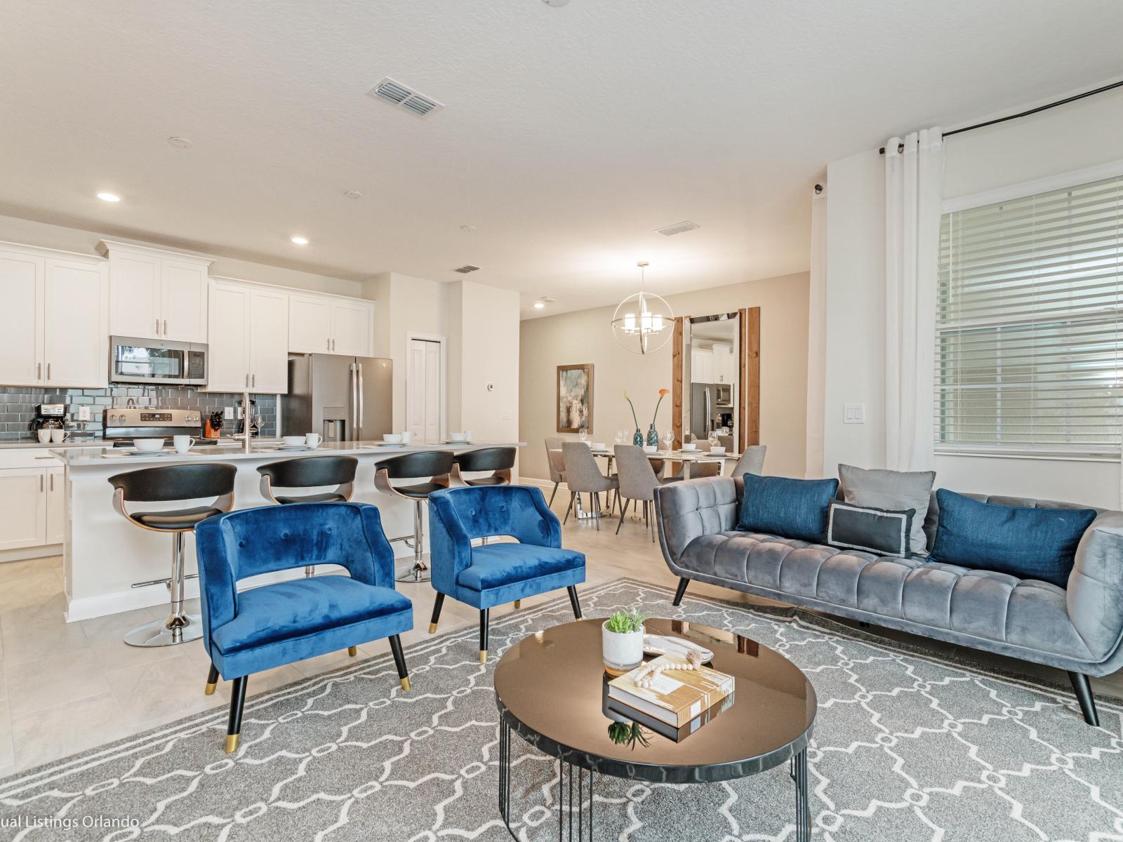 Enchanting Living Area of the Townhouse in Kissimmee Florida - Beautiful living room with an open layout, creating a sense of spaciousness - Thoughtful mix of textures, from plush rugs to tasteful throw pillows