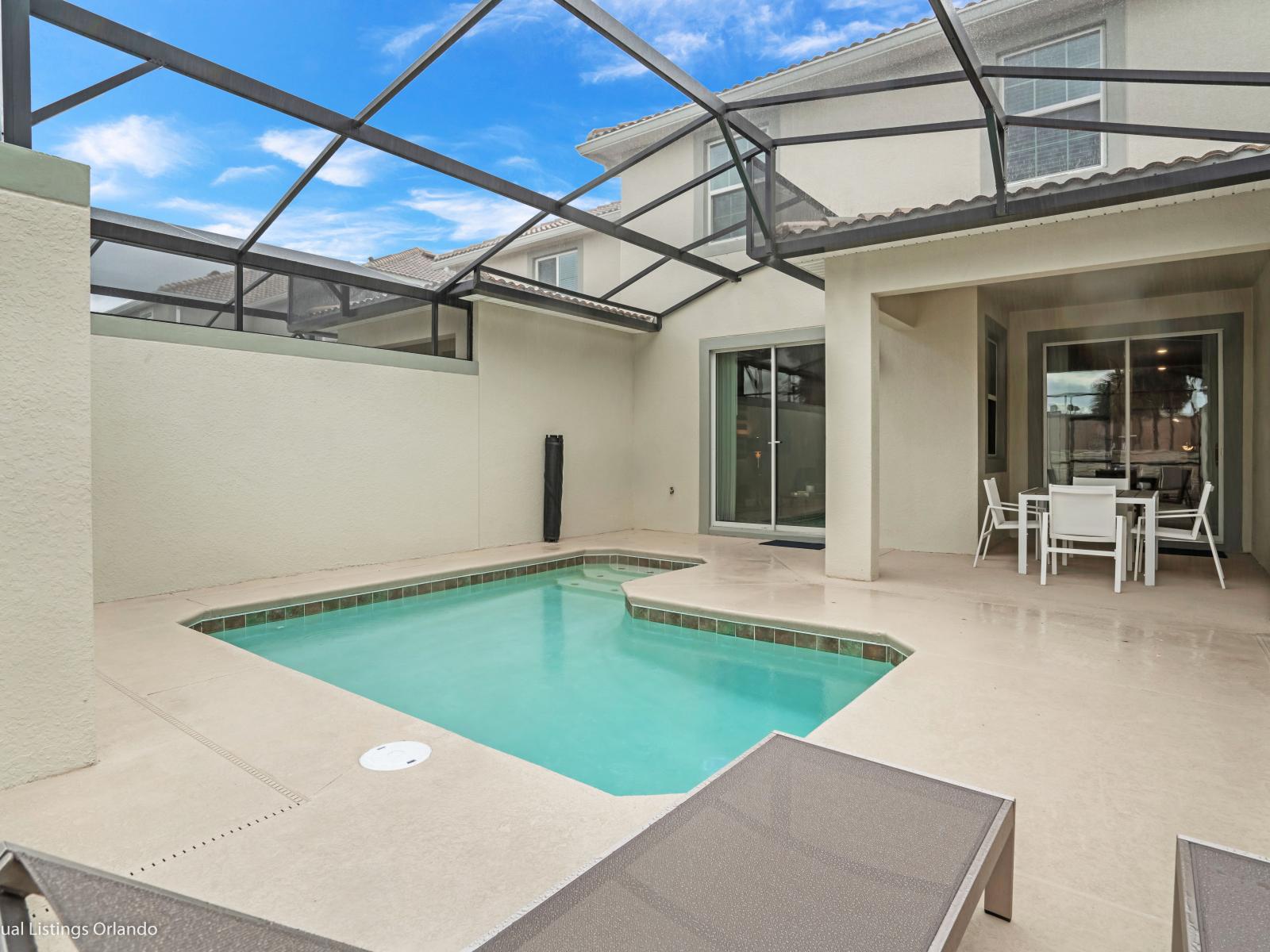 Calming Private Pool of the Townhouse in Kissimmee Florida - Inviting pool area for a perfect getaway - Cozy outdoor seating - Comfy lounge chairs for ultimate relaxation